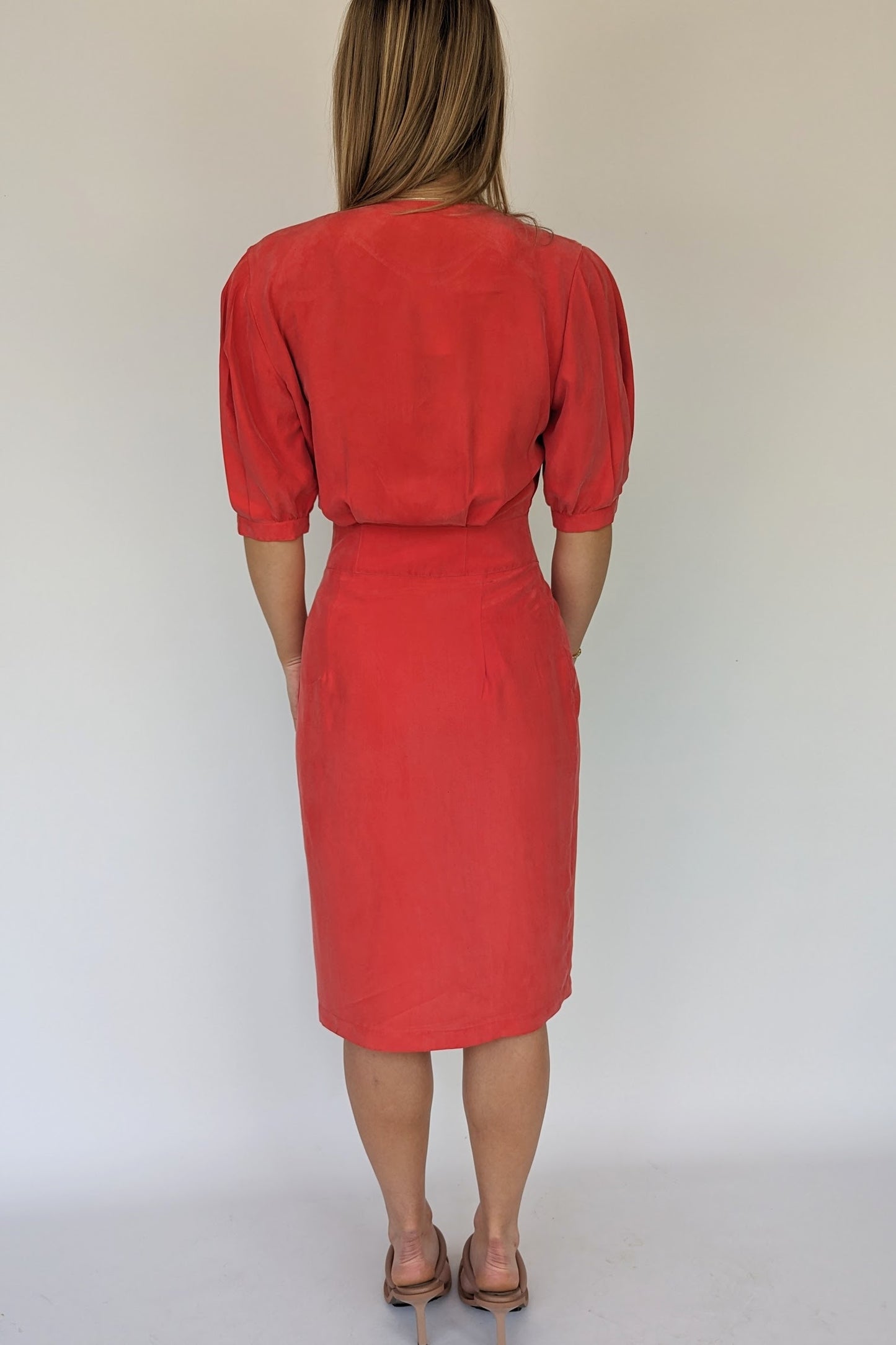 back of 80s vintage red silk red dress with wrap front and pleated shoulders