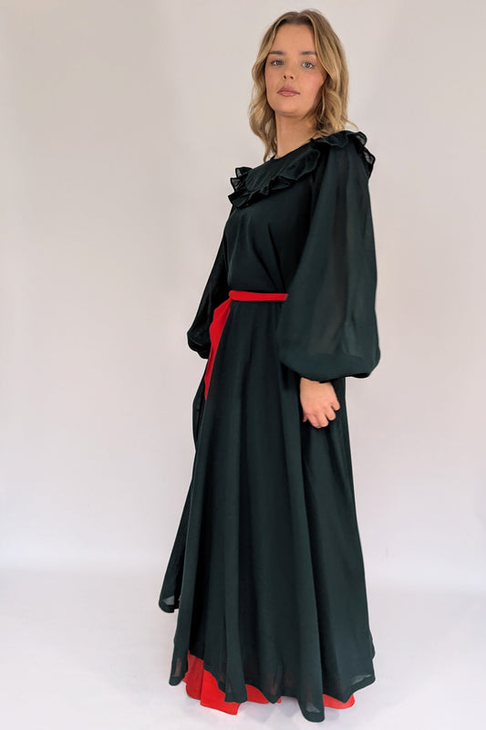 side view of 1970s Gina Fratini wool maxi dress with red lining and tie