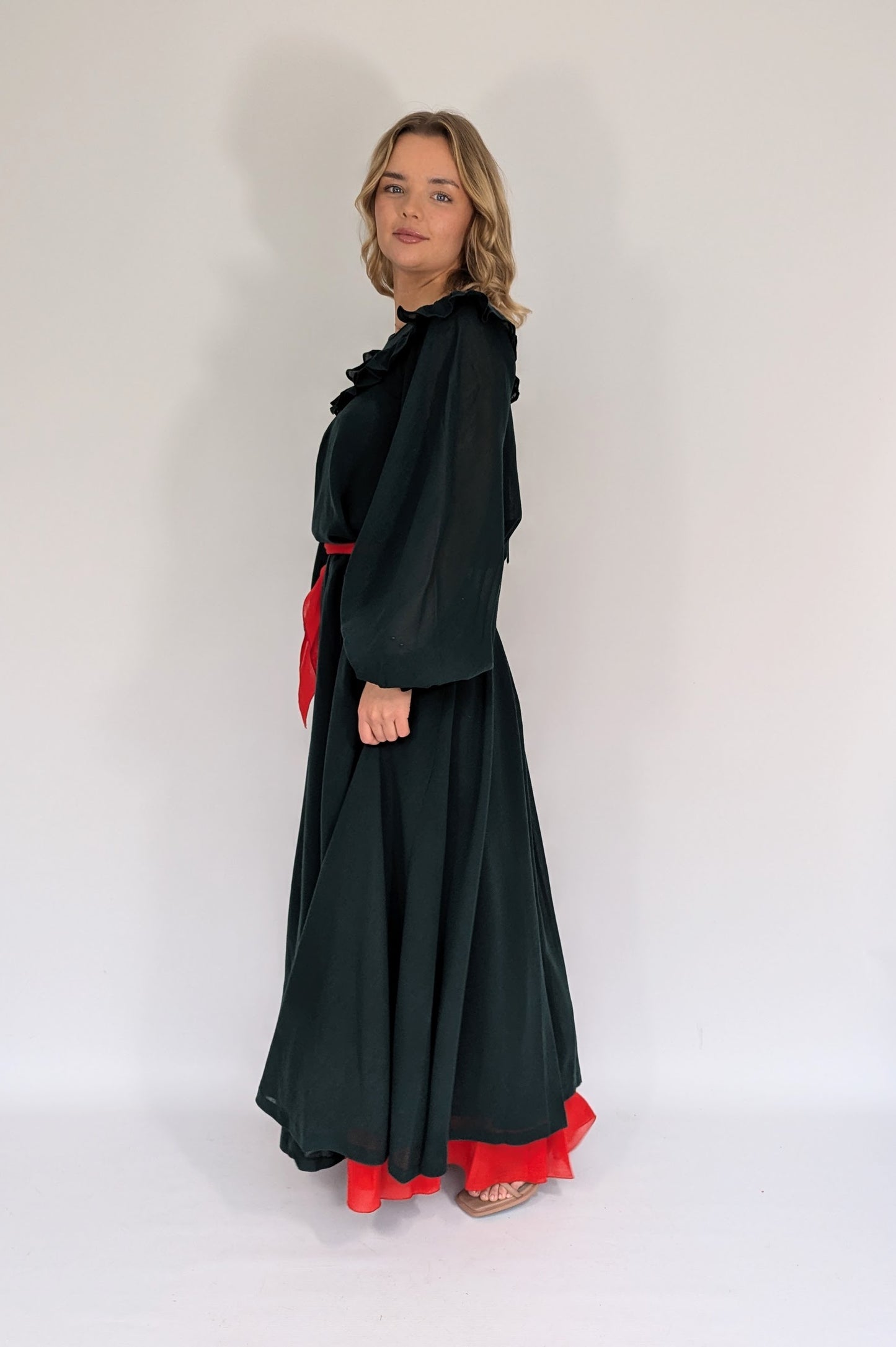 side view of long sleeve vintage 70s gina fratini gown dark green and red