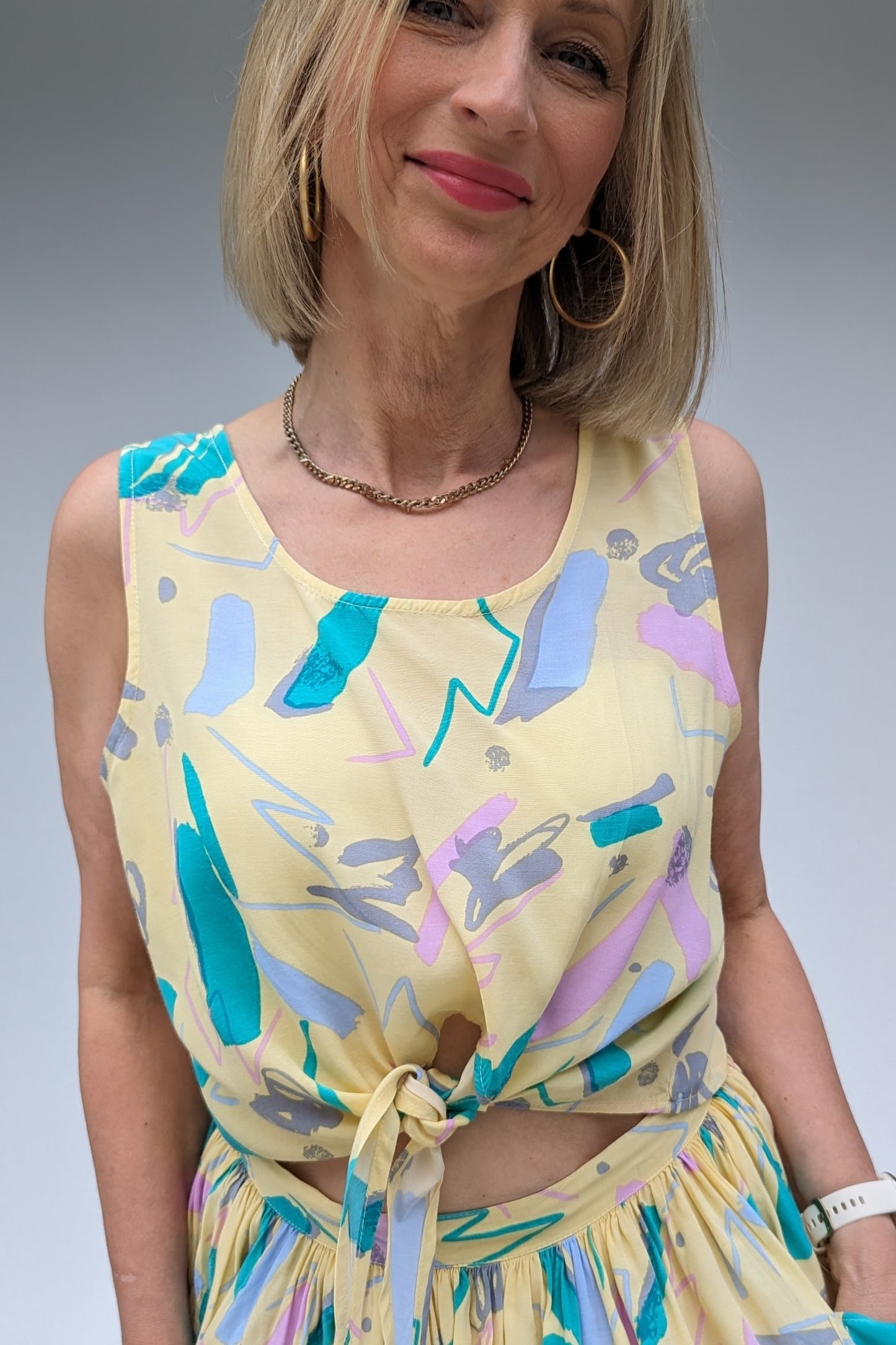 tie top of pastel coloured two piece co-ord set with skirt