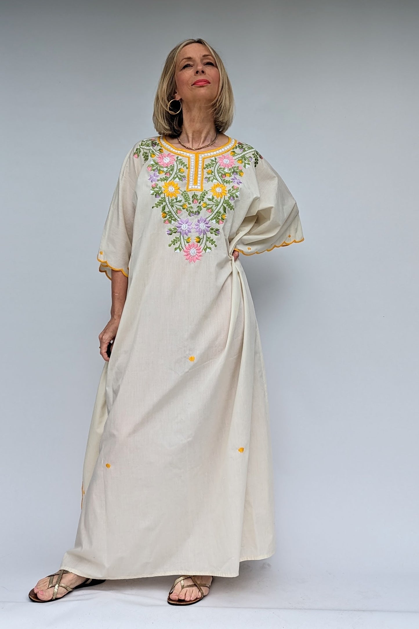 vintage cream kaftan with embroidered flowers in yellow, green, pink and lilac