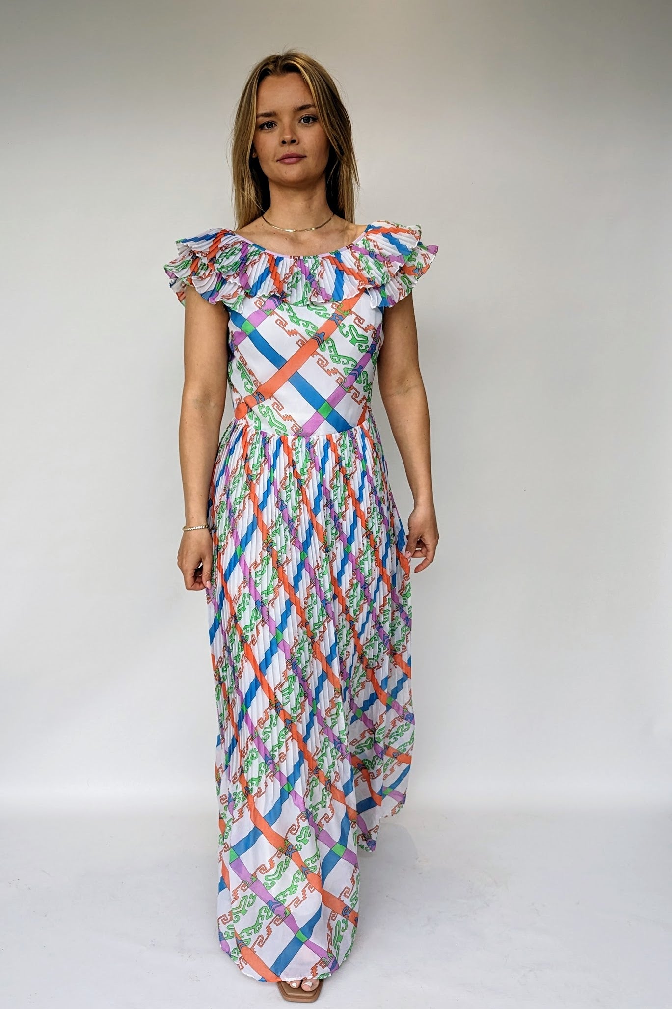 vintage 1970s maxi dress with bold pattern of orange, green, blue and purple geometric pattern