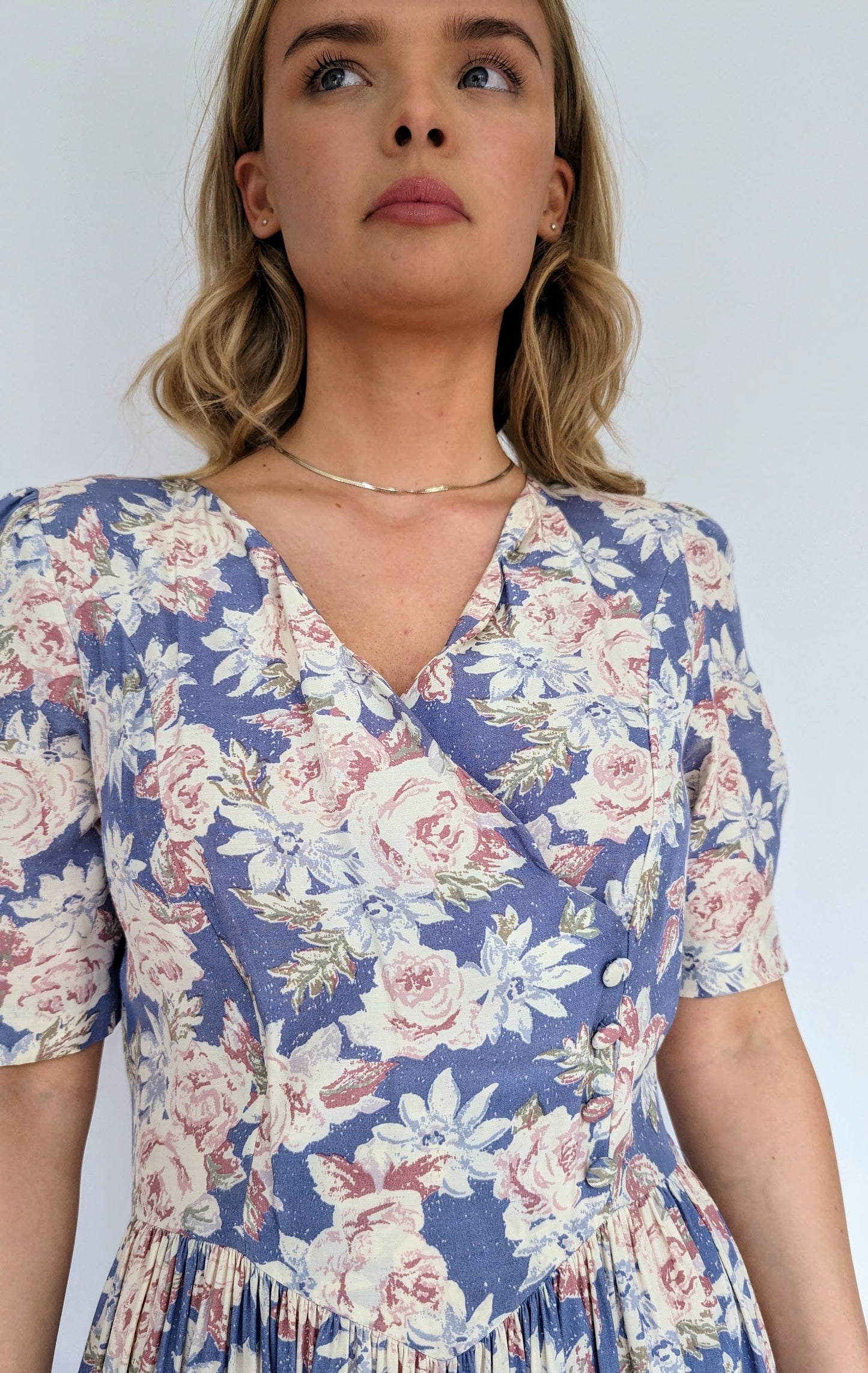 vintage laura ashley long floral dress in light blues and pinks with puff sleeve and gathered v waist and scalloped neckline