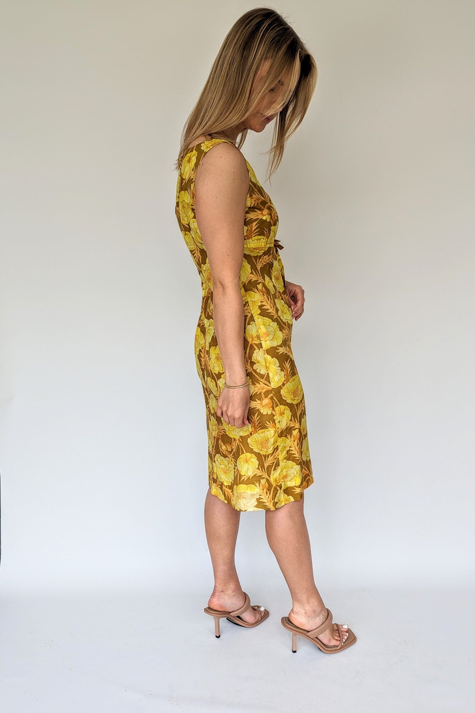 side of 1960s brown and yellow floral shift wiggle dress with empire line and bow