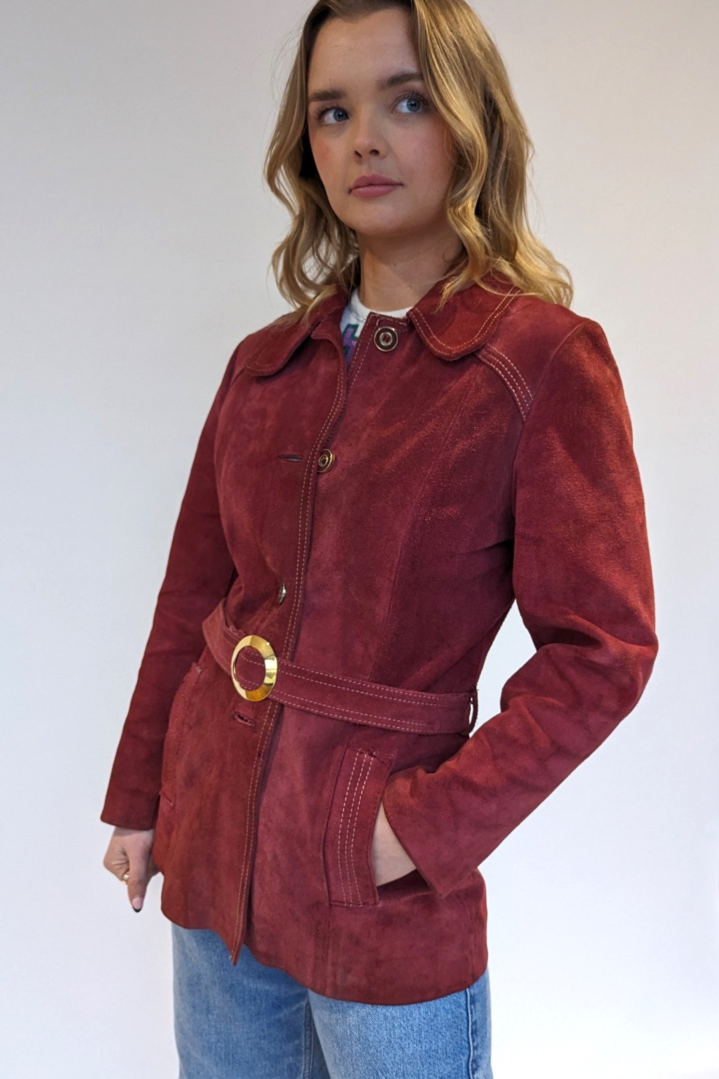 red vintage 1970s coat with gold buckle
