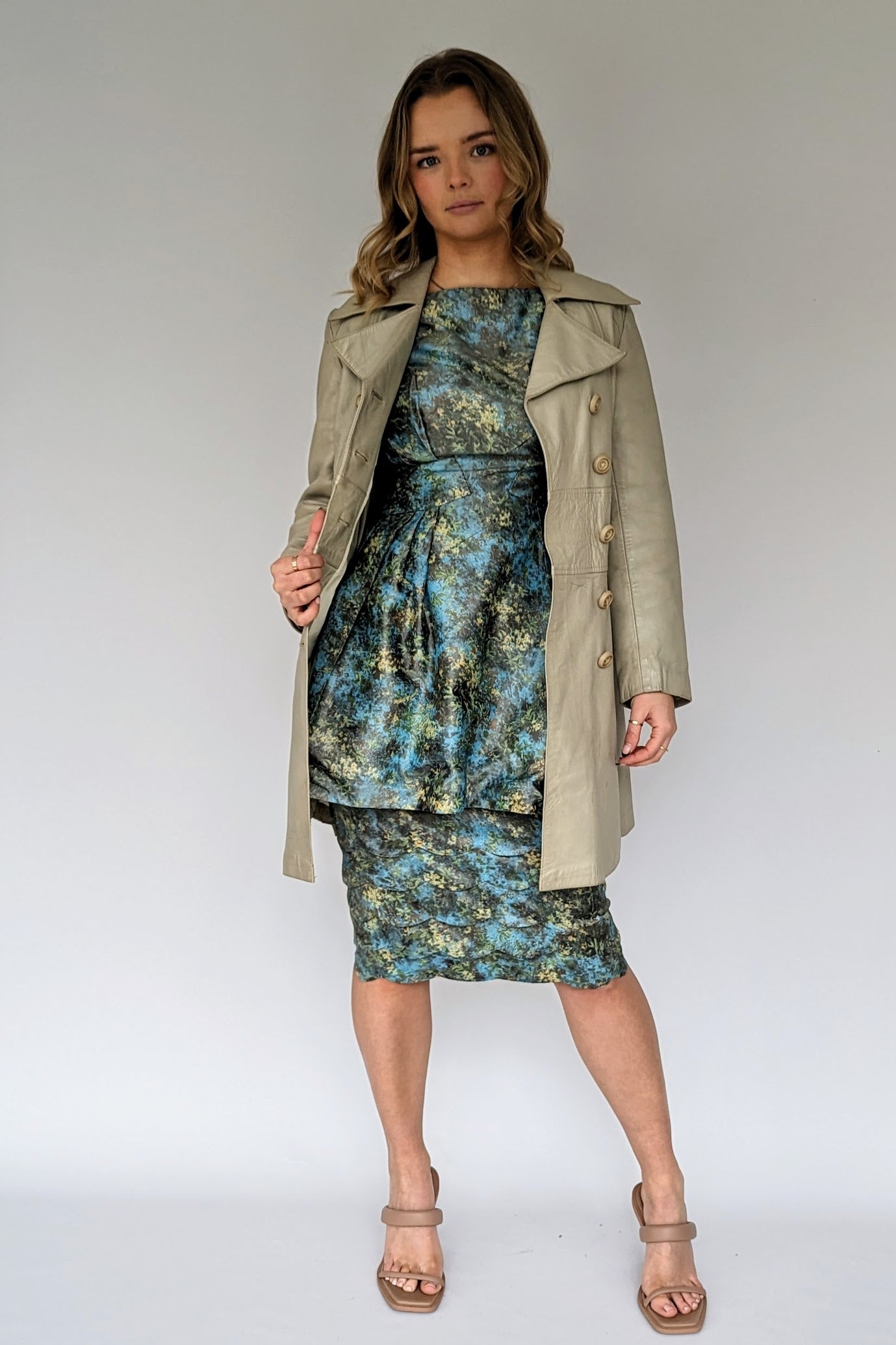 two piece turquoise and gold top and skirt vintage suit with grey mod leather coat