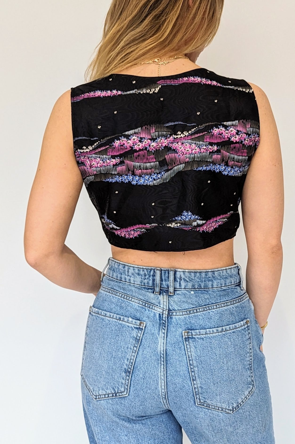 back of vintage black and purple cropped floral top