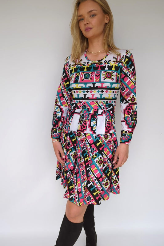 1970s patterned dress with belt and pleats in what, black, pink and turquoise geometrics pattern