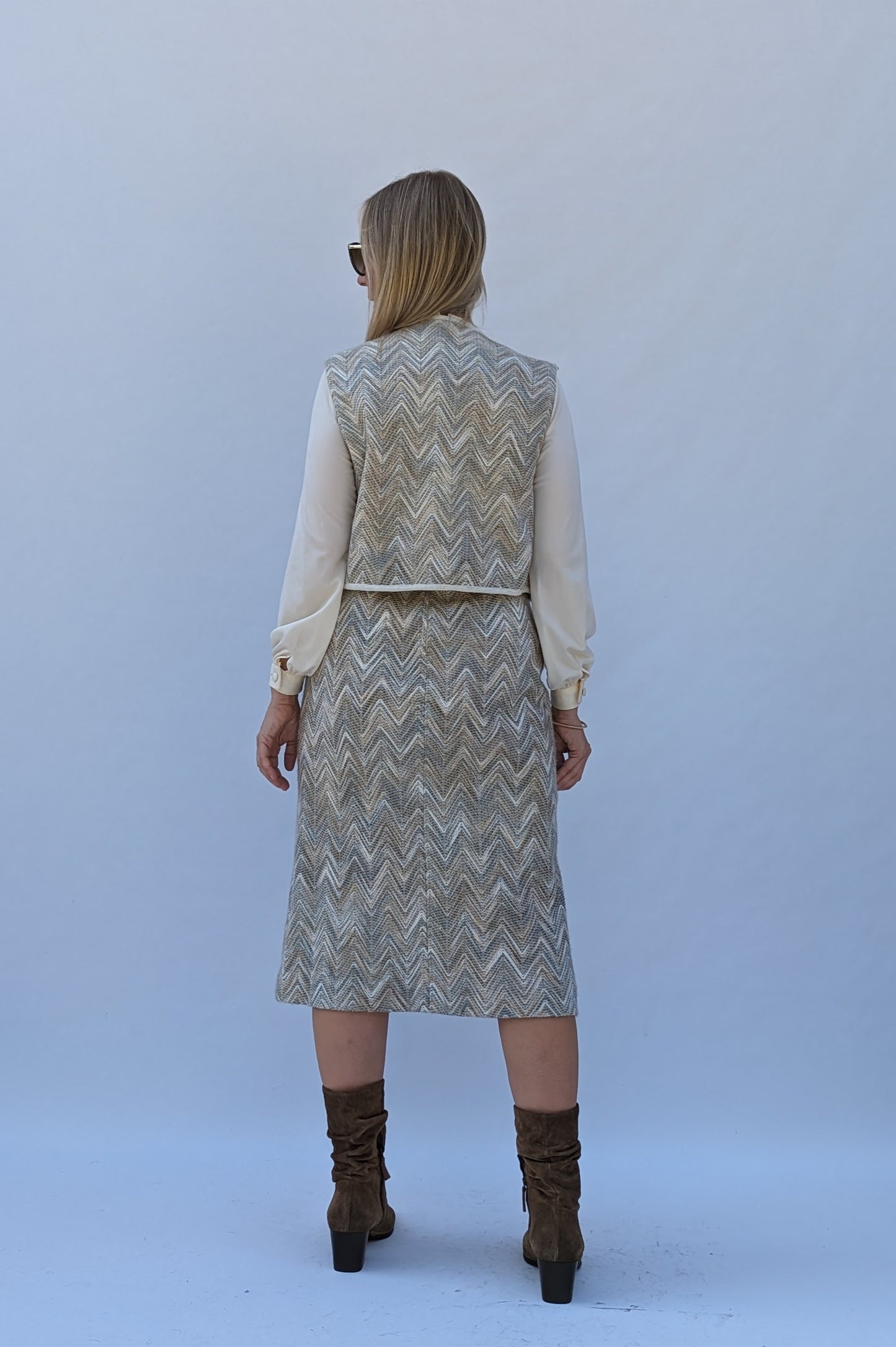 Back of 1970s cream top and woven skirt dress with waistcoat