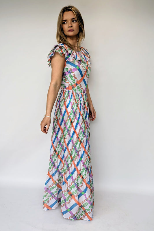 vintage 1970s maxi dress with bold pattern of orange, green, blue and purple