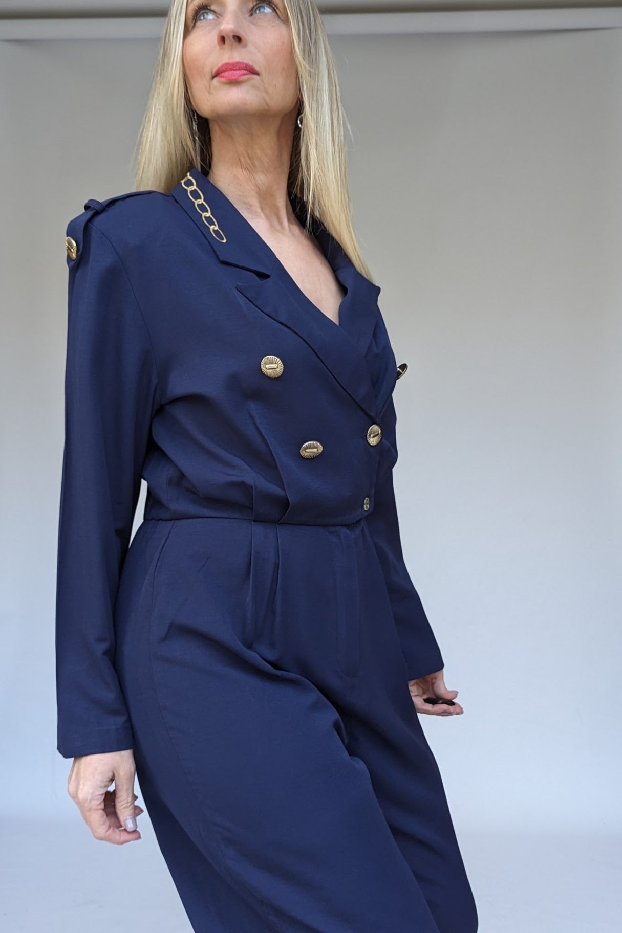 Navy jumpsuit with gold button epaulettes