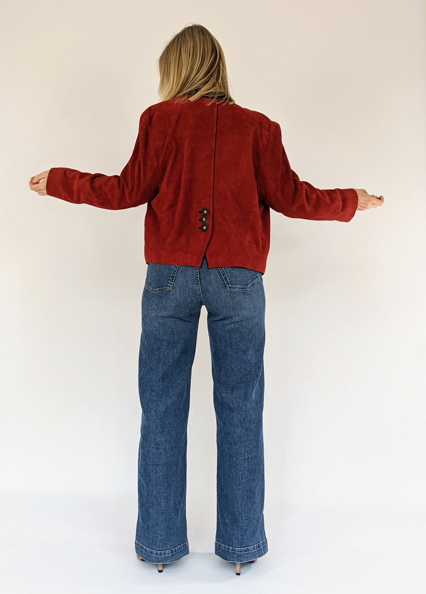 back of red short suede jacket