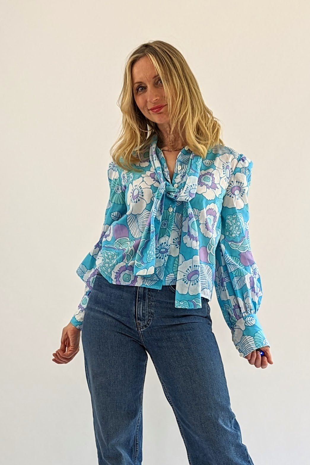 open tie of Floral vintage blue tie neck blouse with long sleeves