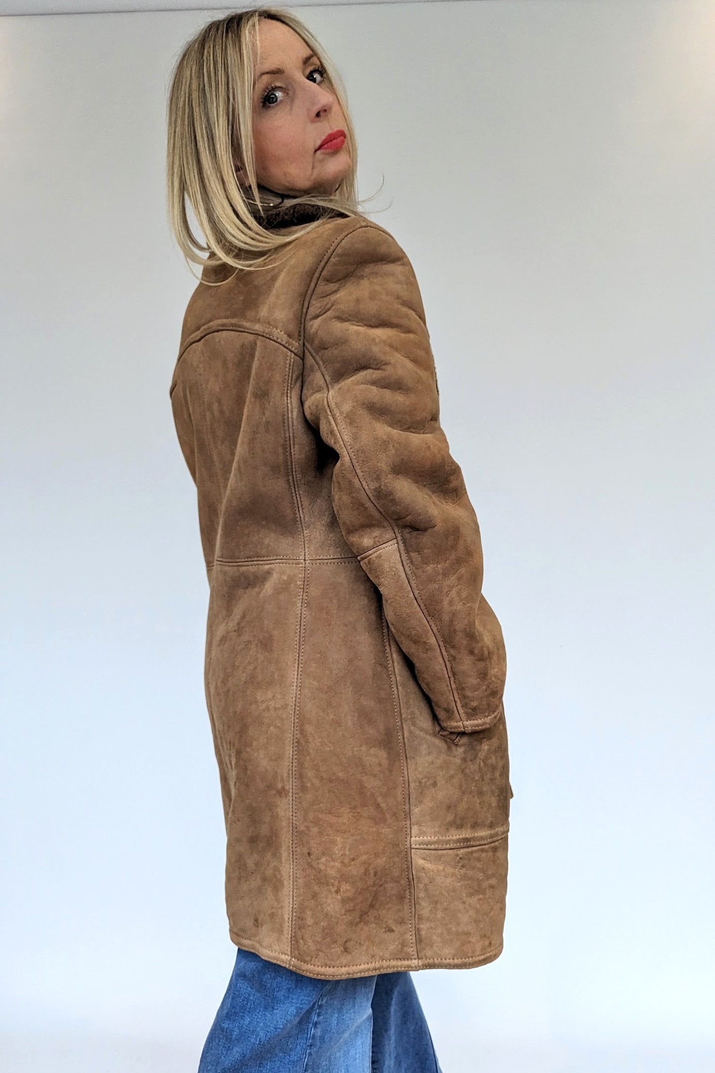 Side angle of double breasted vintage sheepskin coat