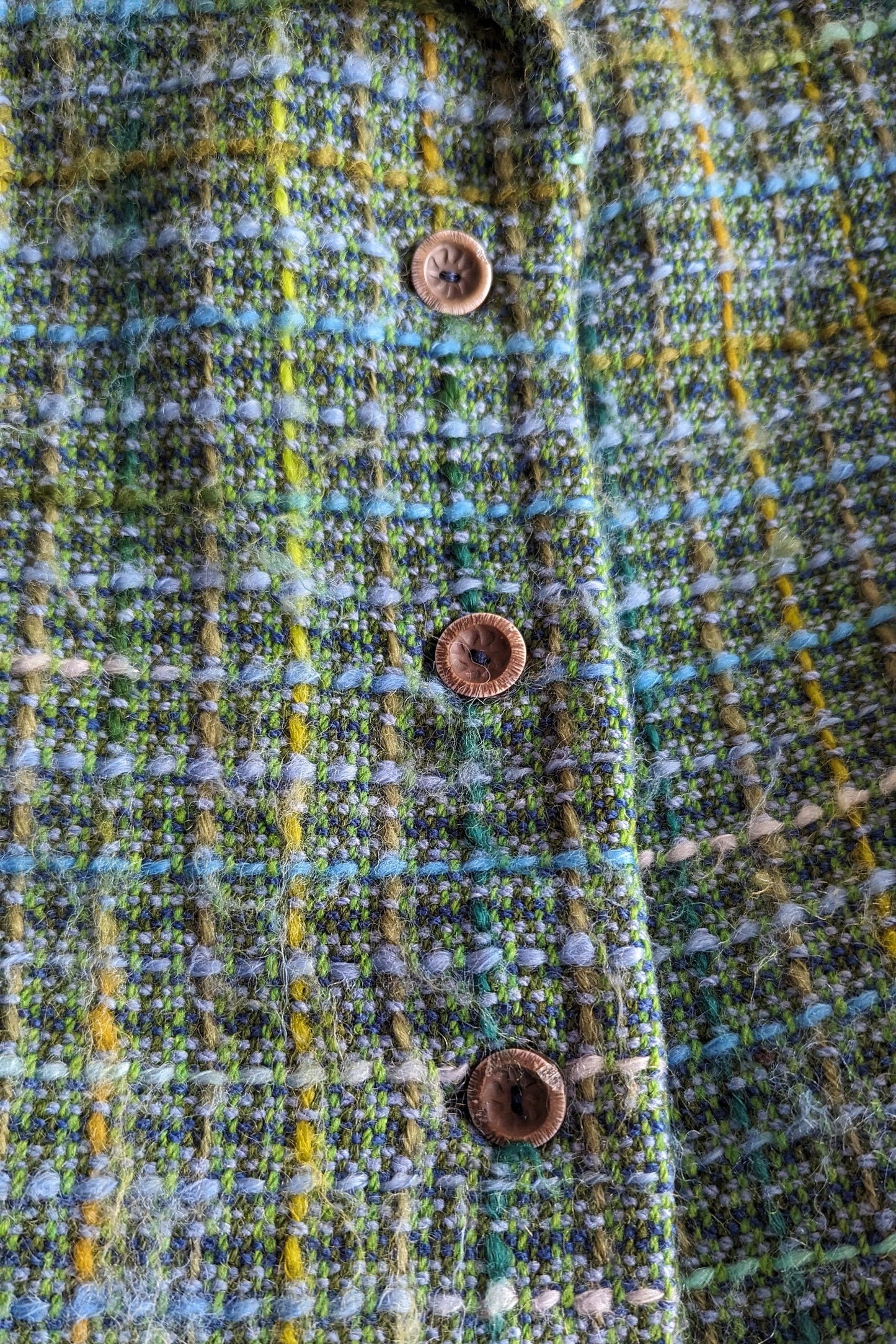 buttons of tweed coat