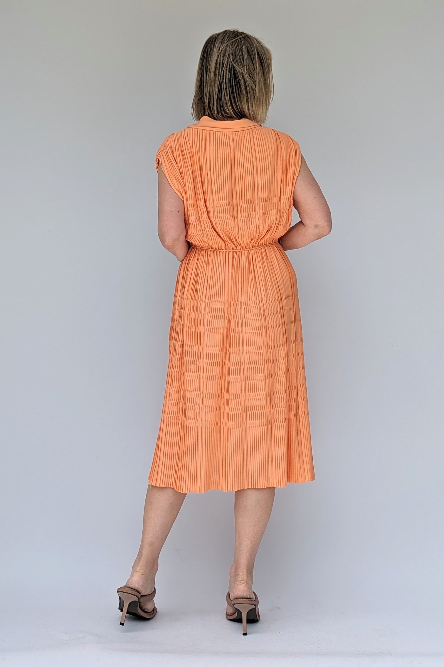 back of 1960s peach pleated midi dress