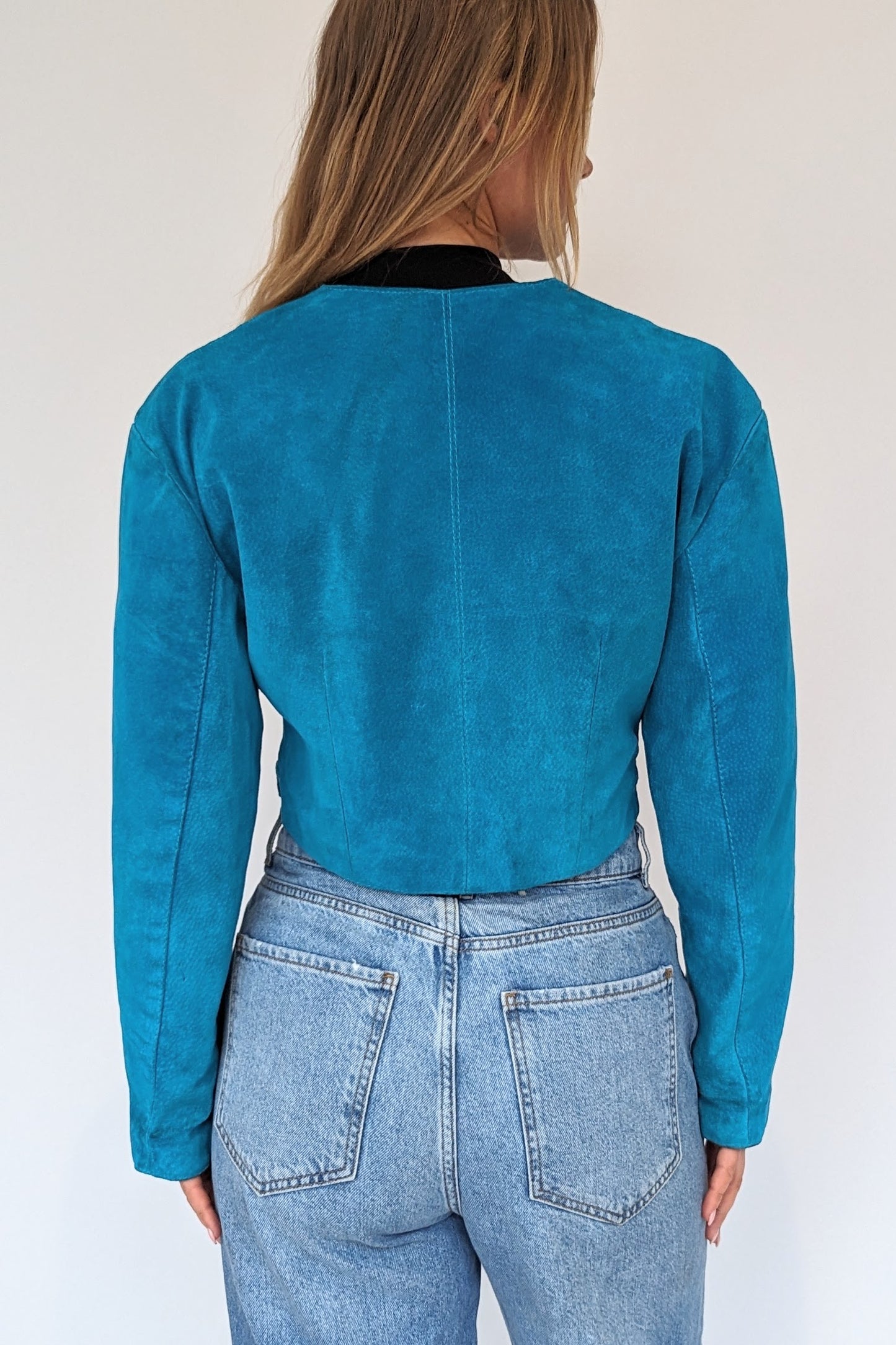 back of back of 80s Turquoise Suede Cropped Jacket vintage with poppers vintage