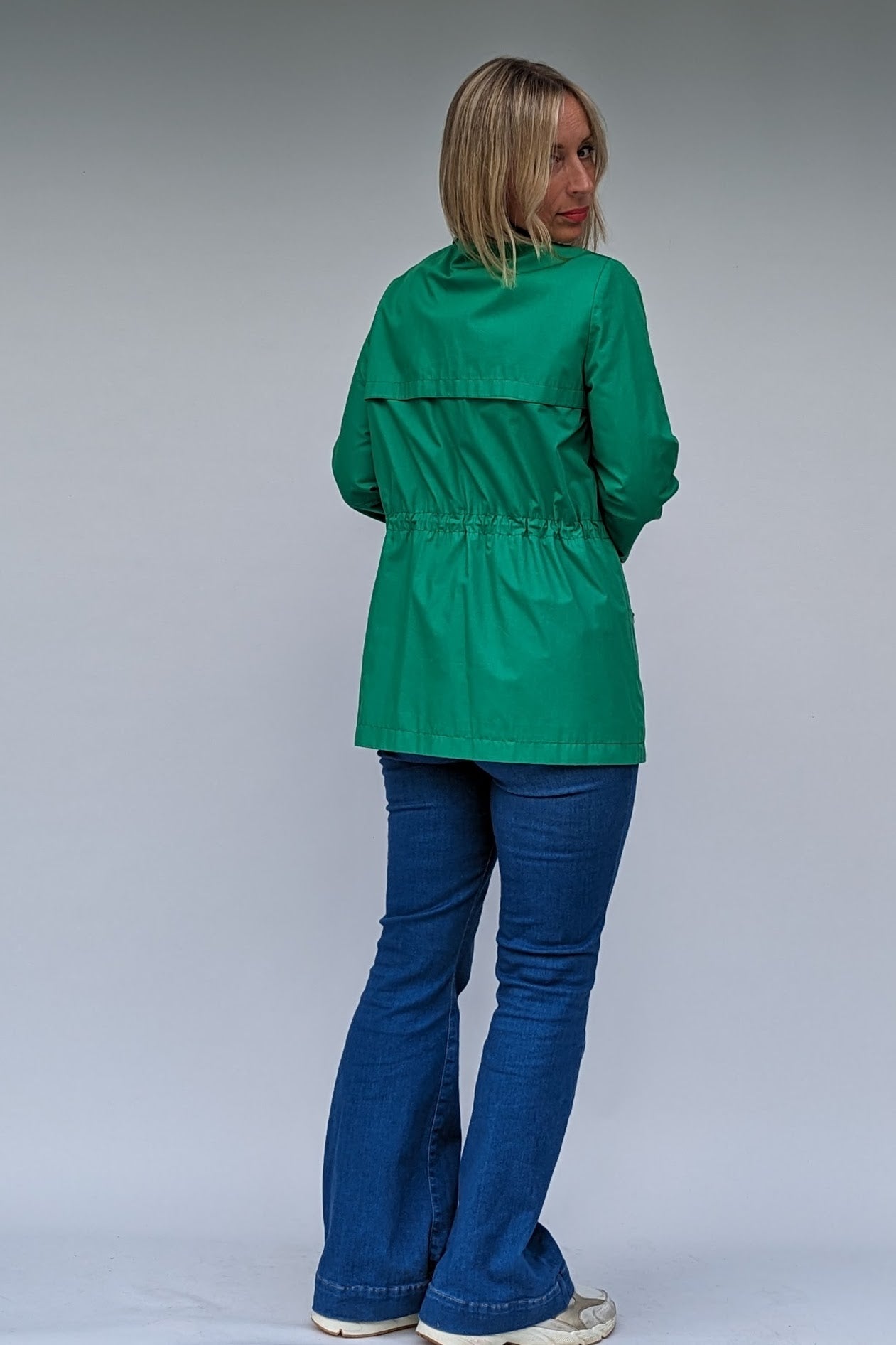 back of green 80s coat with dagger collars