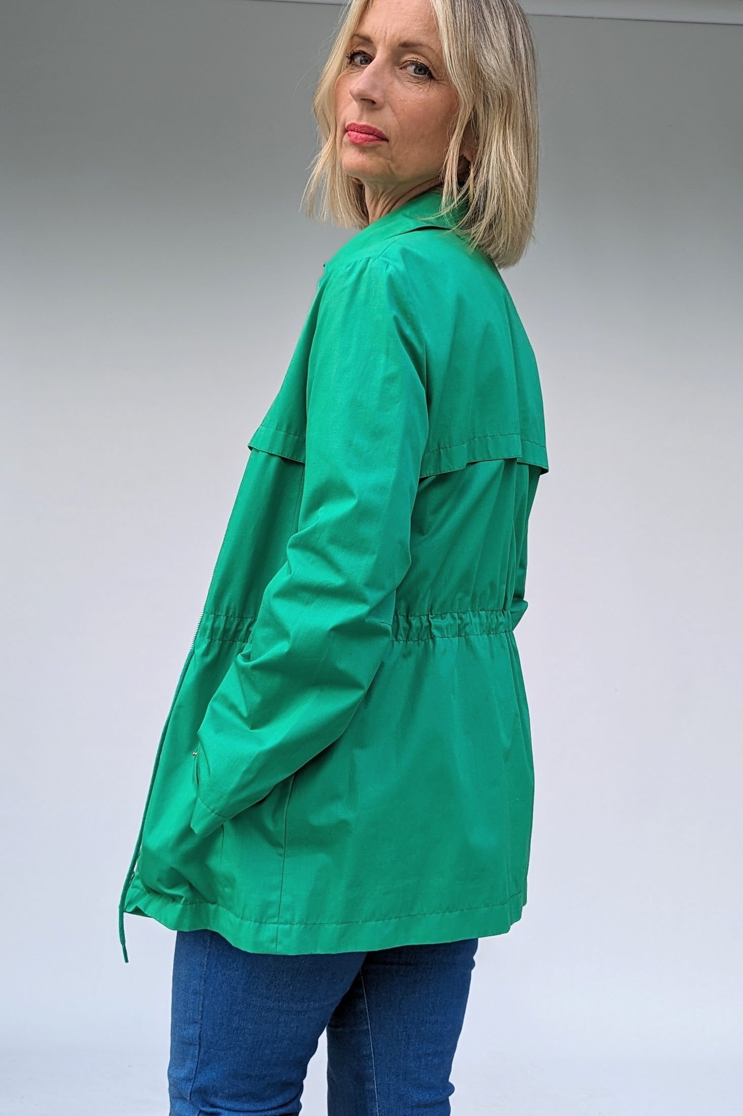 back of green vintage coat with drawstring waist