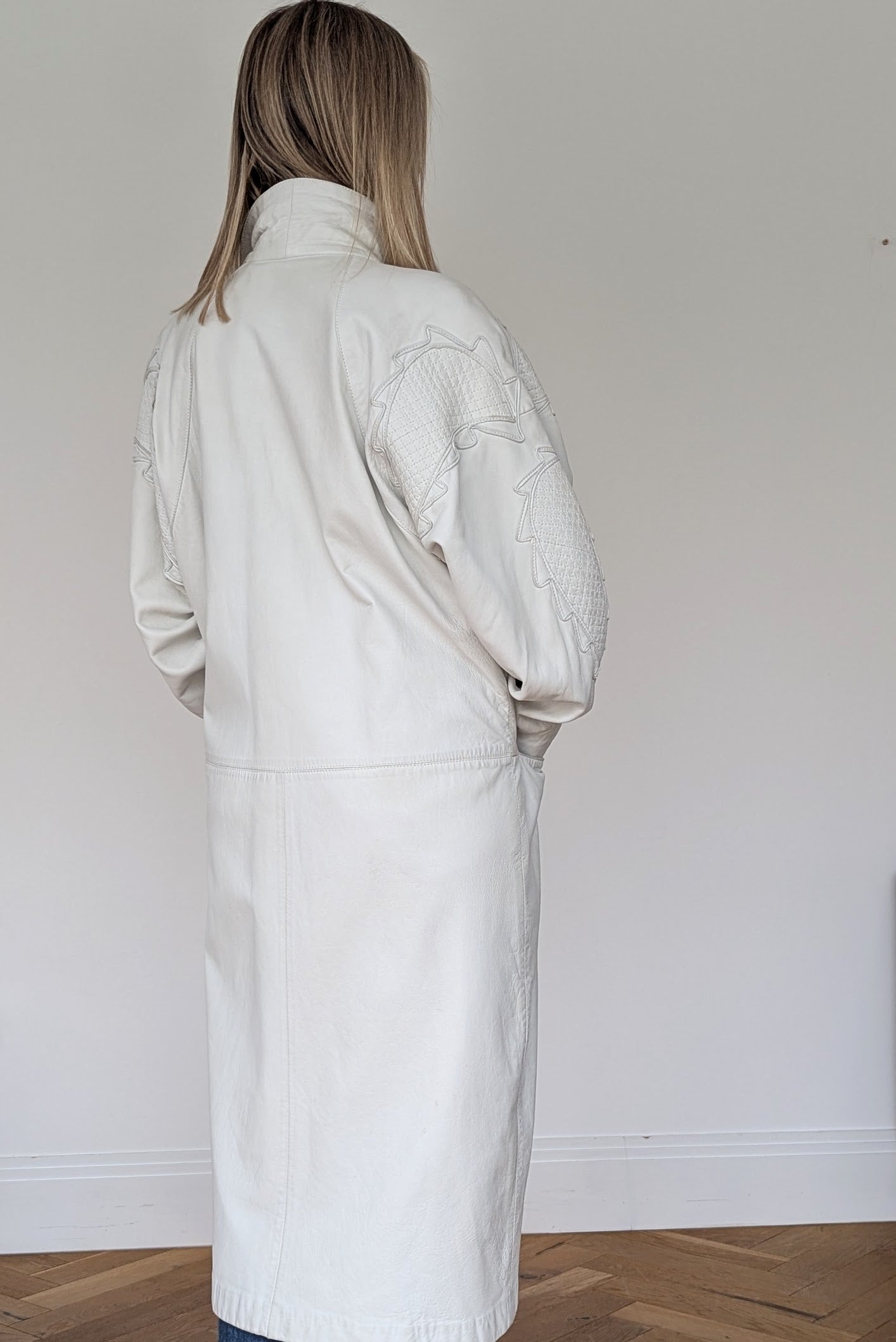 back of long white leather coat with applique design vintage 80s retro