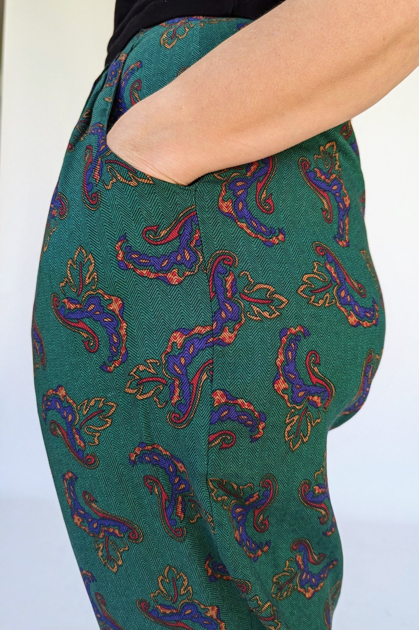 green trousers with paisley pattern of red, blue and orange