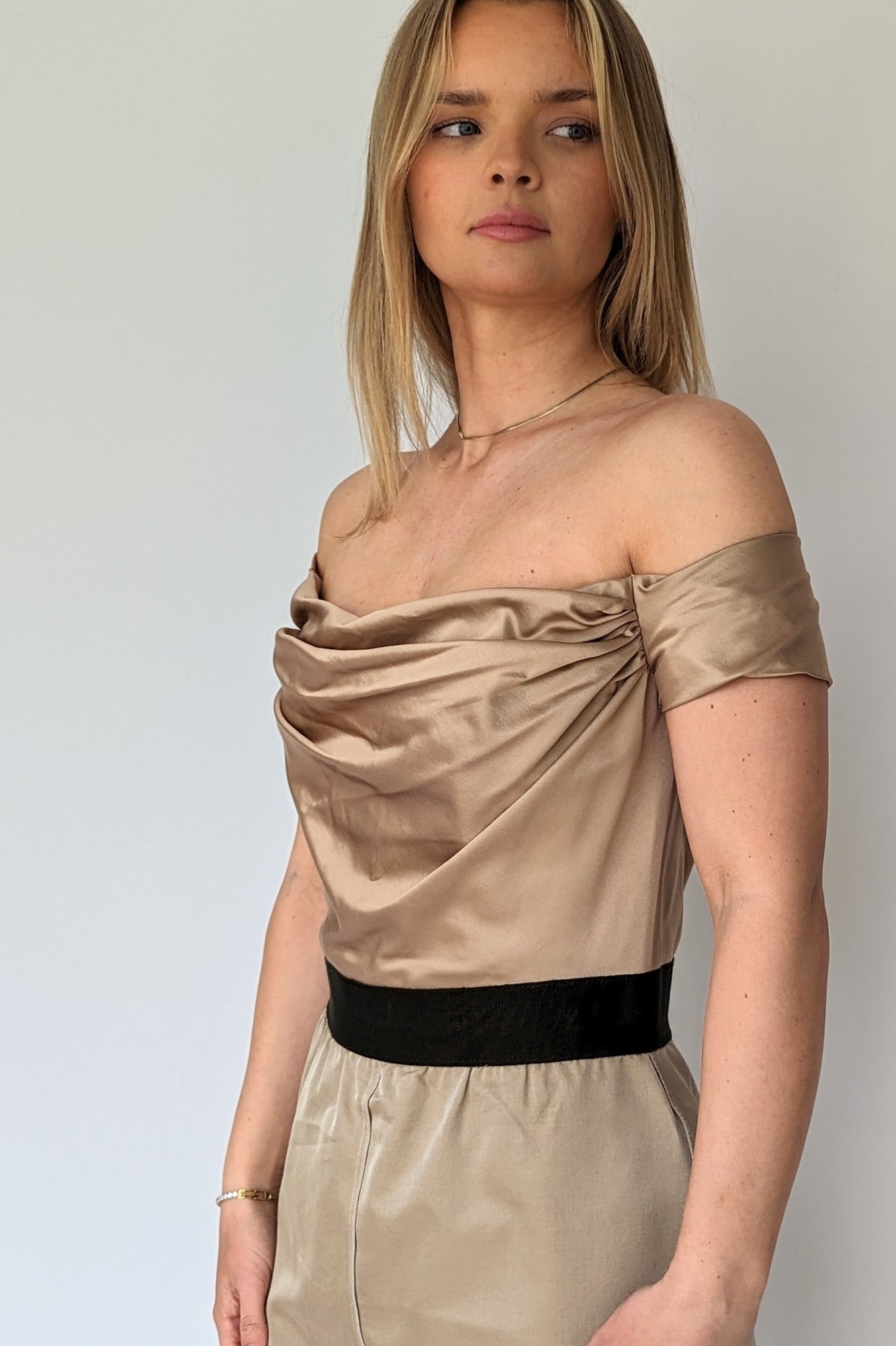 top of gold satin off shoulder dolce & gabbana cocktail dress with ruched bust