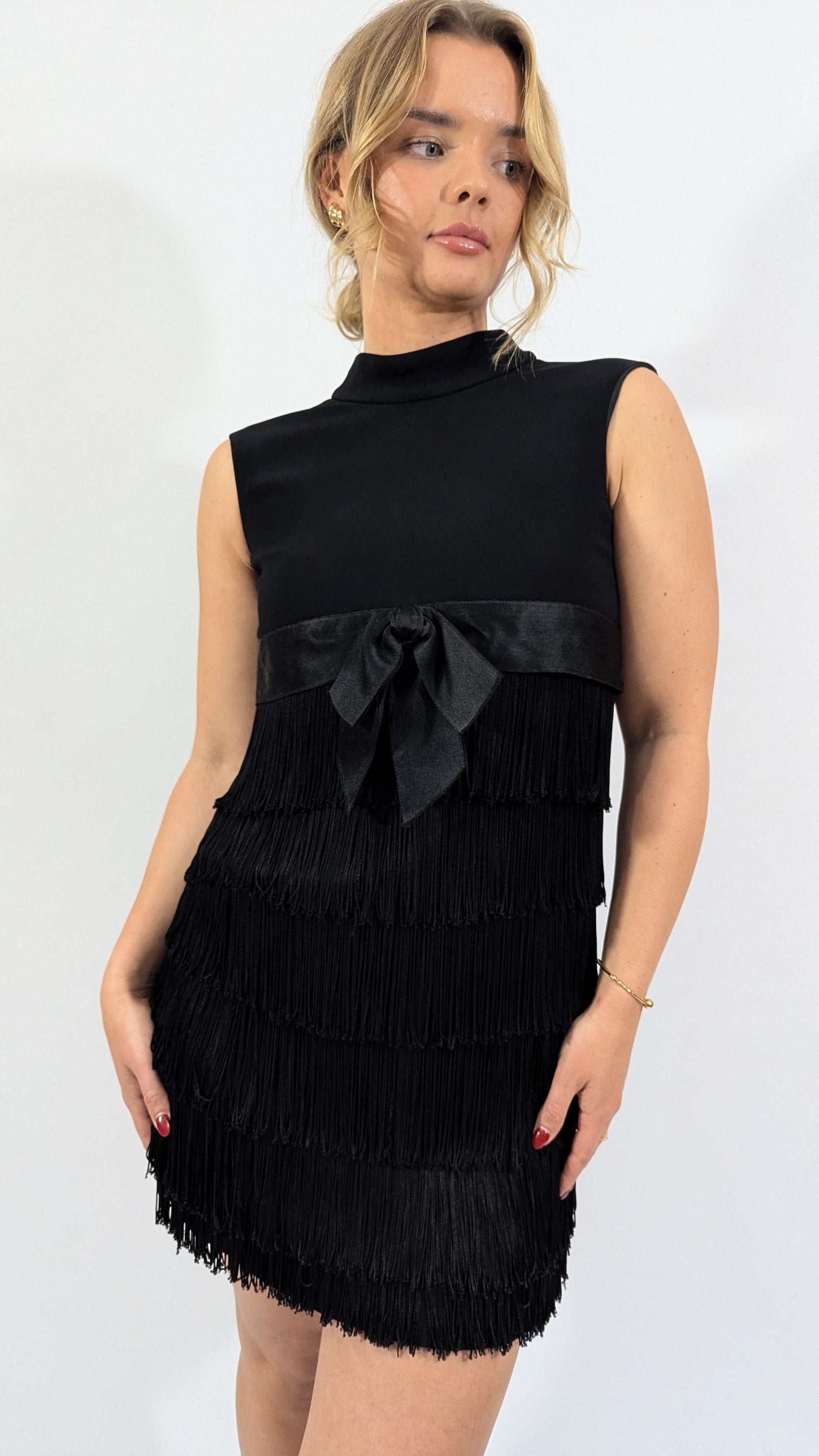 front view of 1950s cocktail vintage black fringe dress