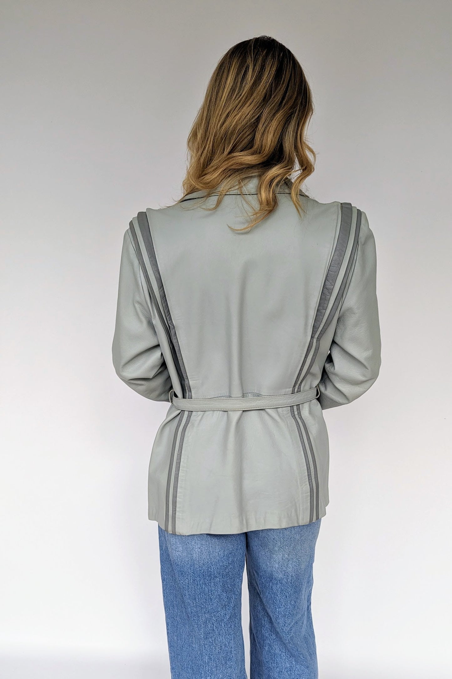 back of 1980s vintage retro grey leather jacket with two tone grey stripe detail 