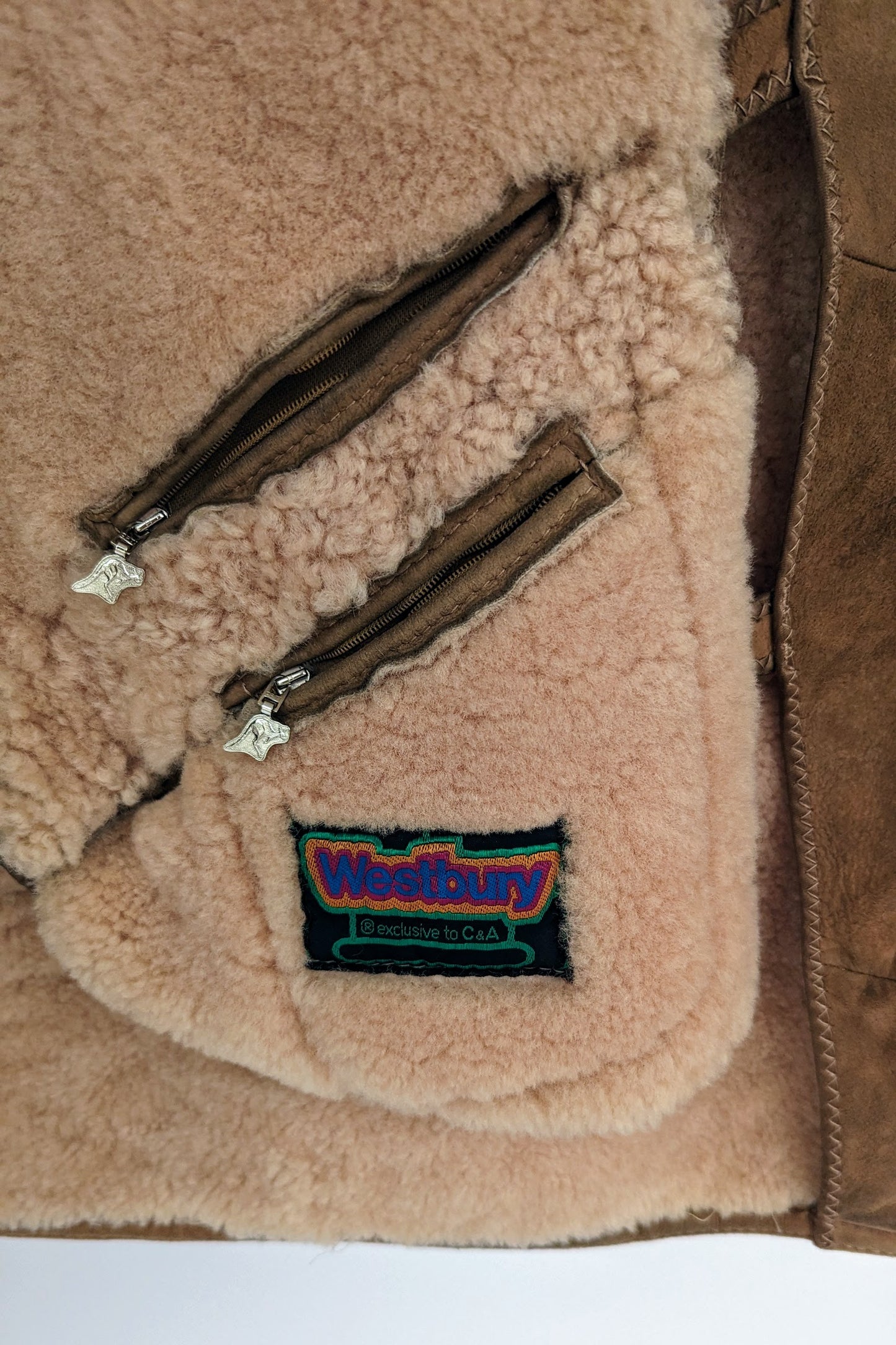 pockets and label Westbury inside of double breasted vintage sheepskin coat