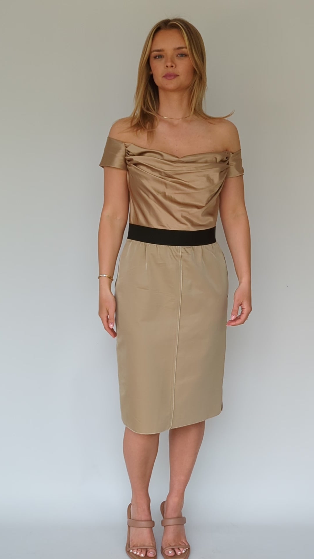video of gold satin off shoulder dolce & gabbana cocktail dress
