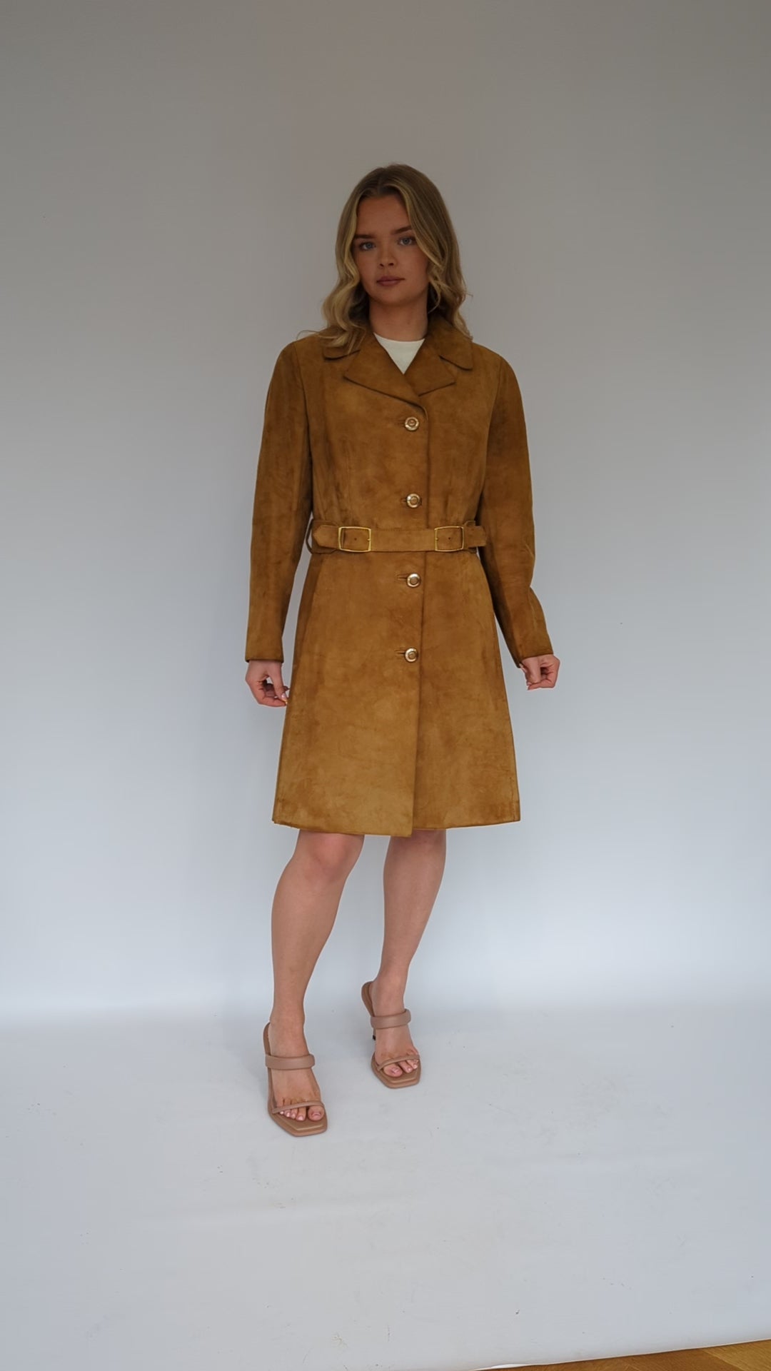 video showing 70s long tan suede ladies coat with gold buttons