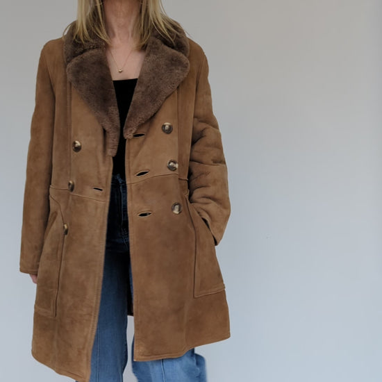 Video showing double breasted vintage sheepskin coat
