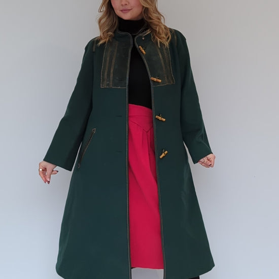 video of dark green wool vintage coat with pockets