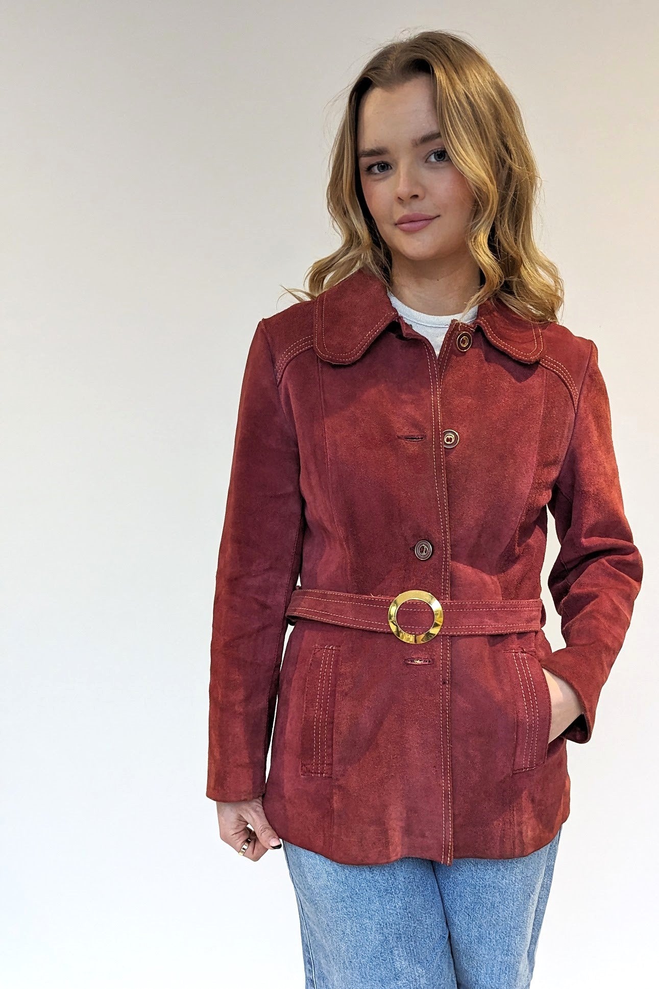 red vintage suede coat with gold buckle