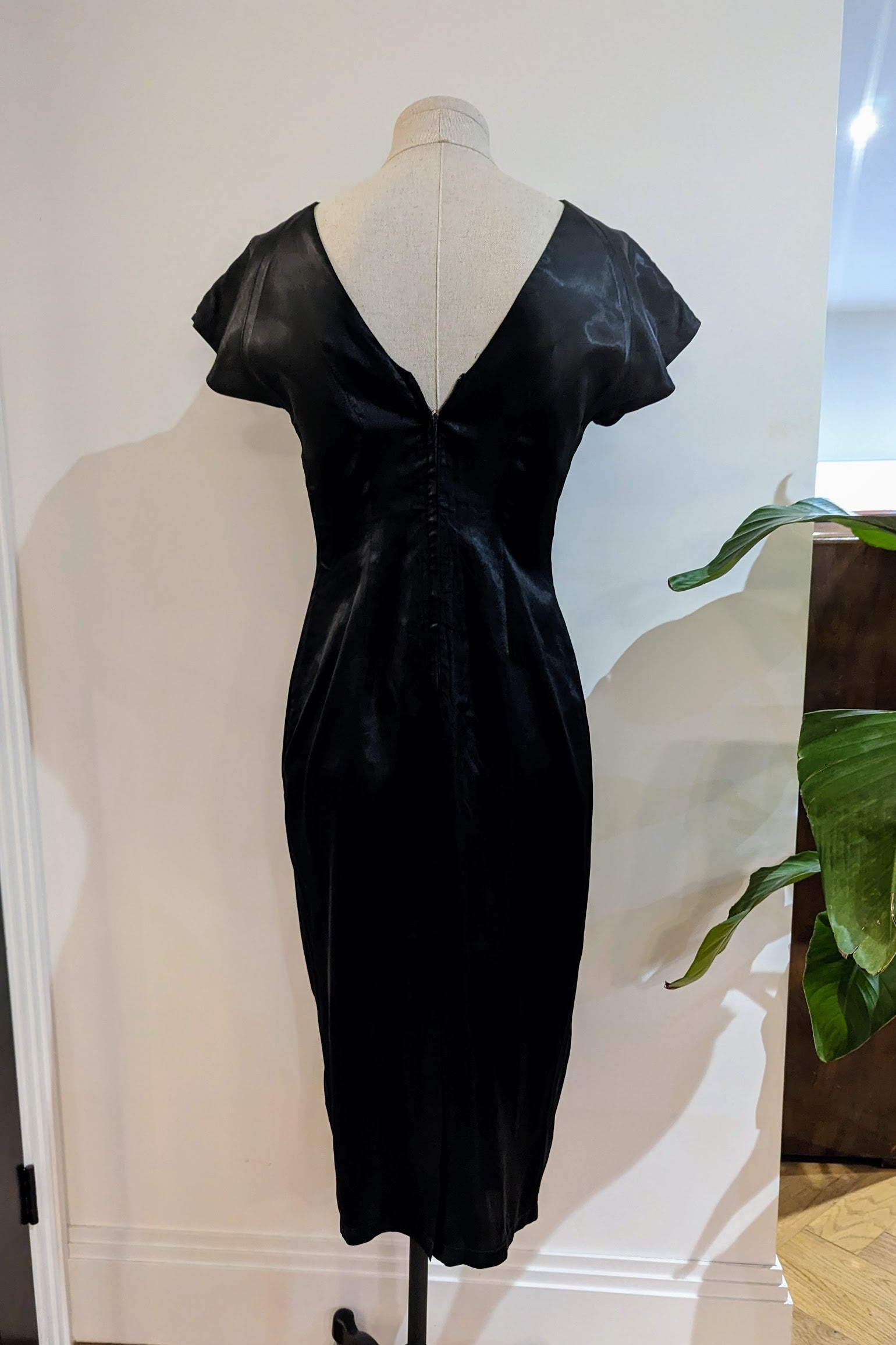 Back v on black satin dress