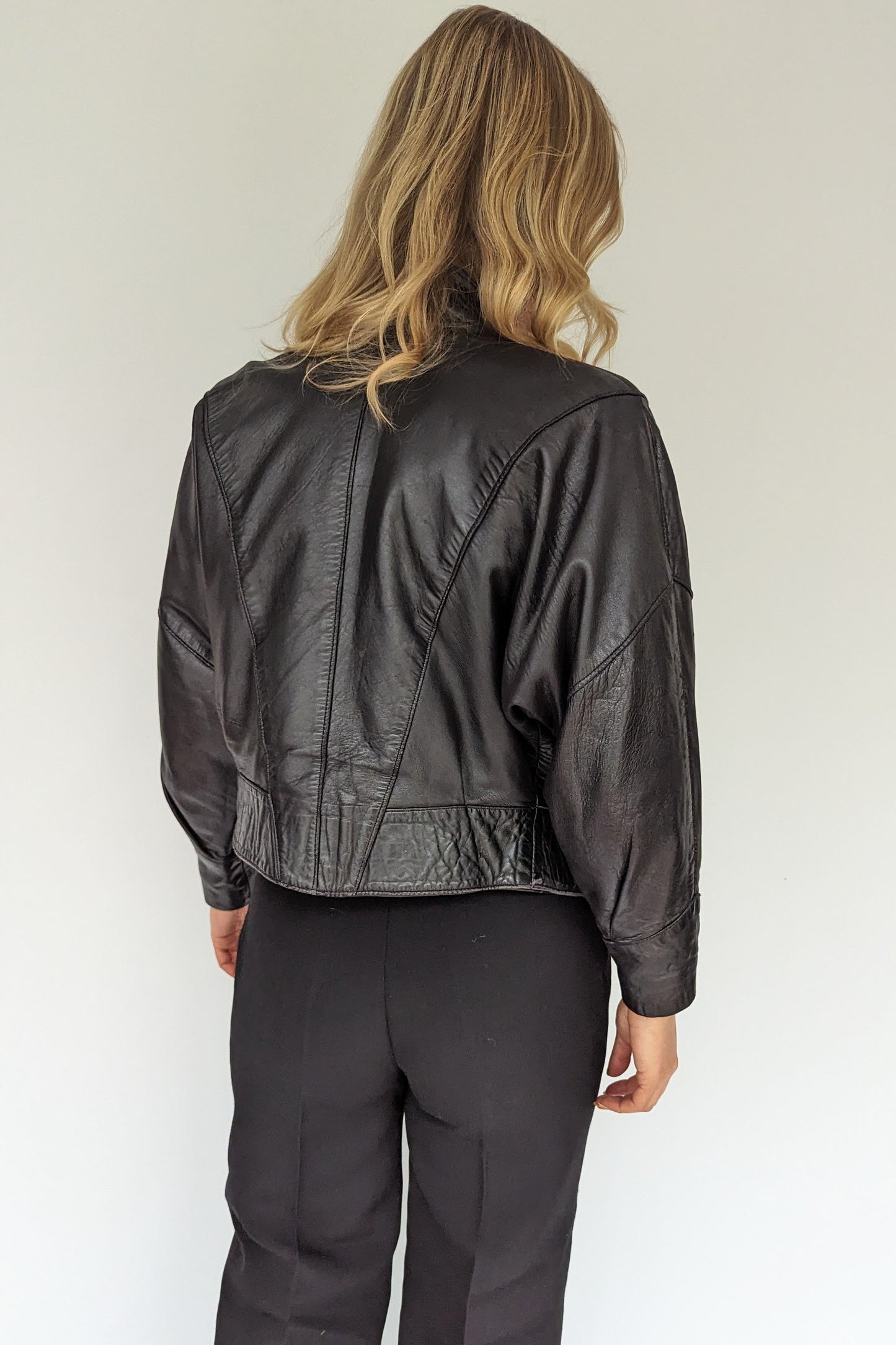 back of 80s retro black leather jacket