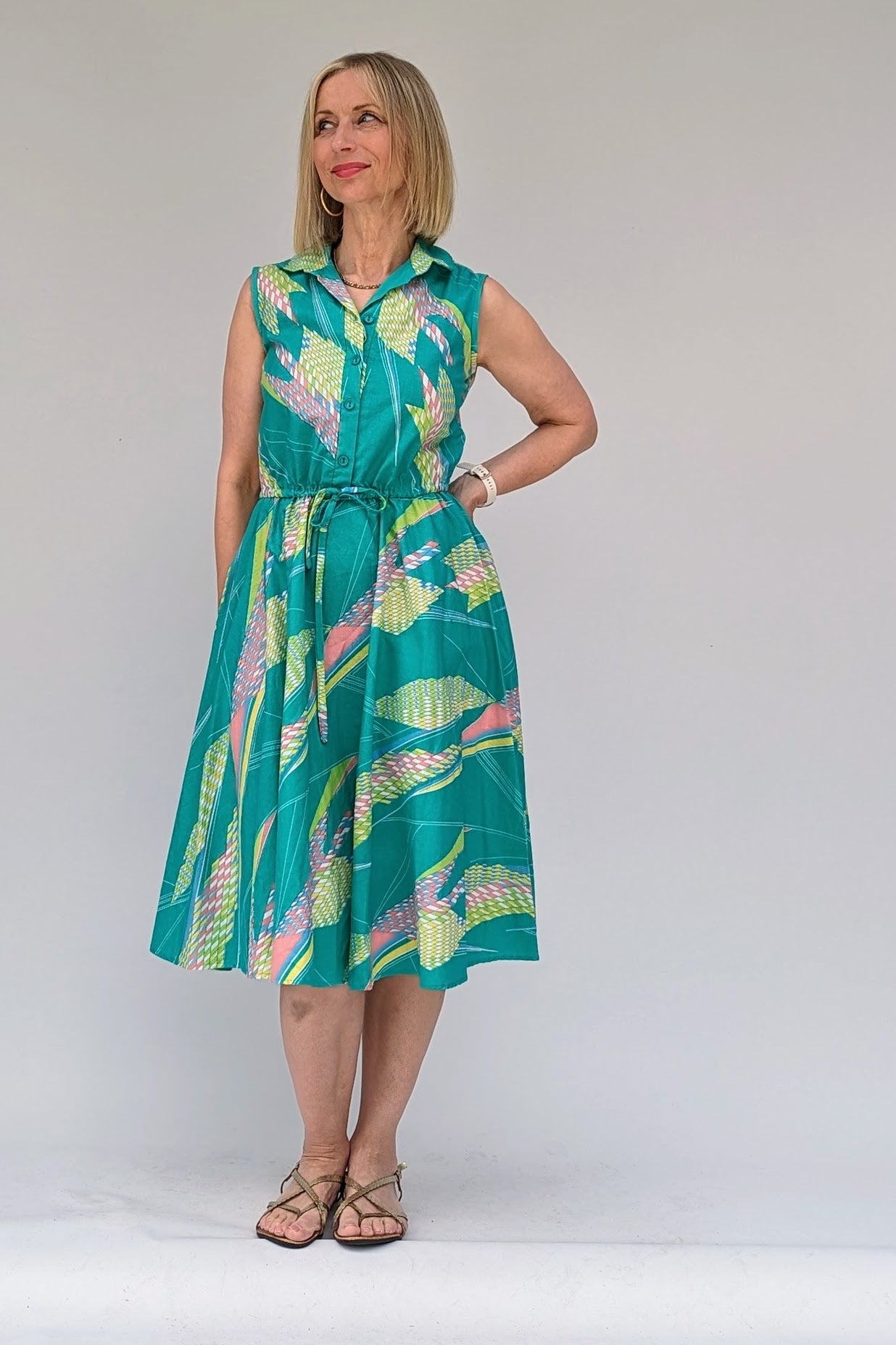 Vintage cotton summer tea dress in turquoise with a geometric pattern in pastels