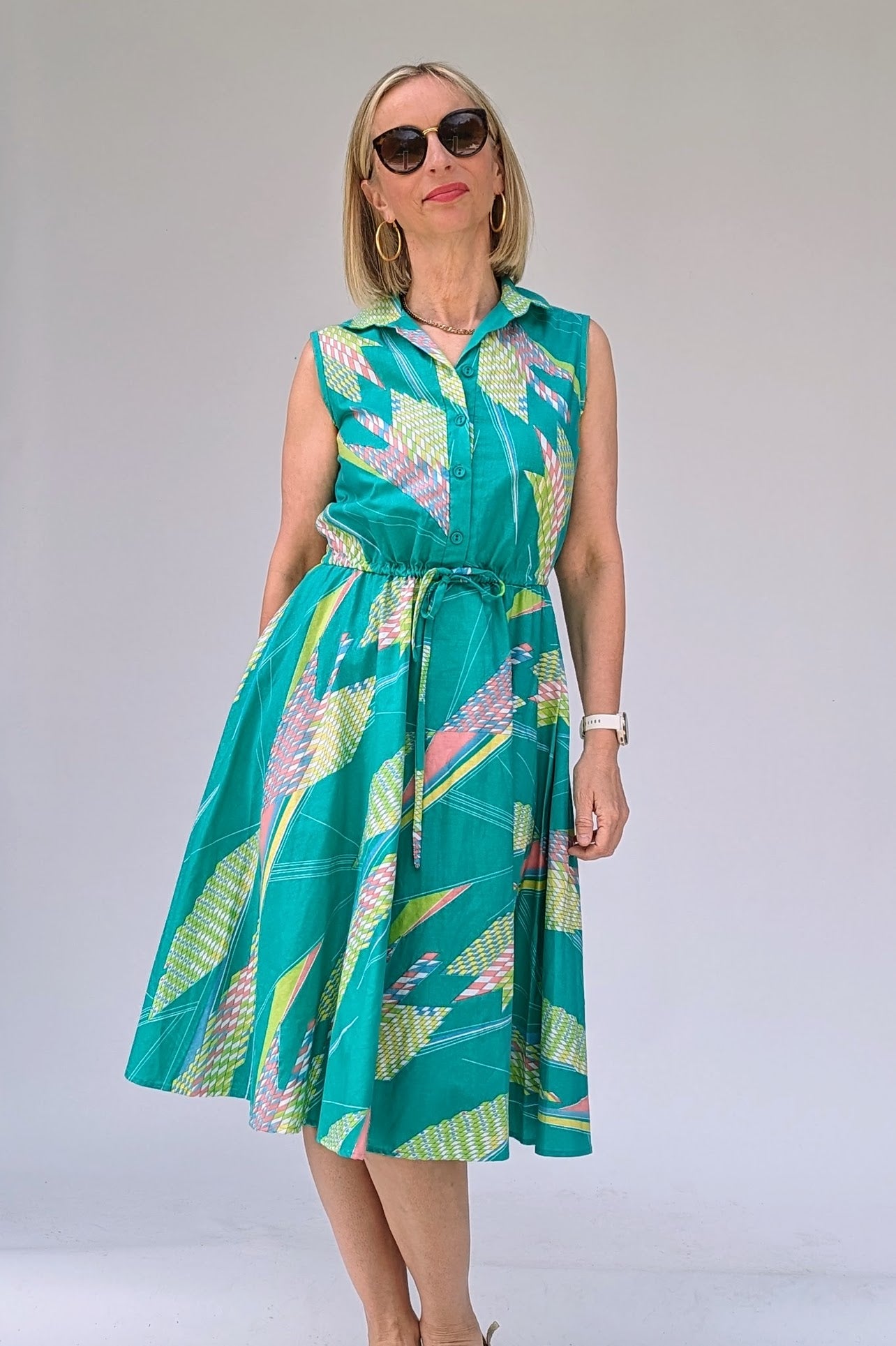 Vintage cotton summer tea dress in turquoise with a geometric pattern in pastels