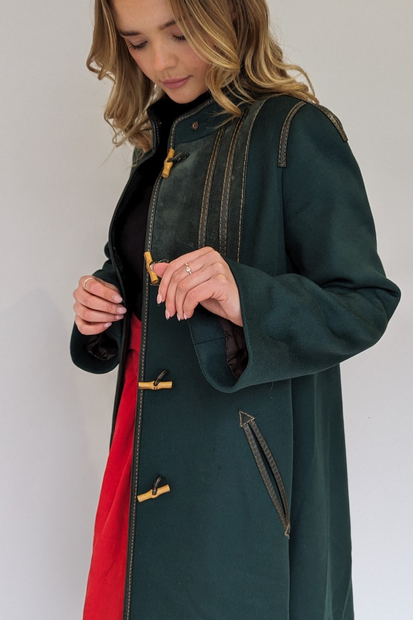 Flared sleeve on green wool coat