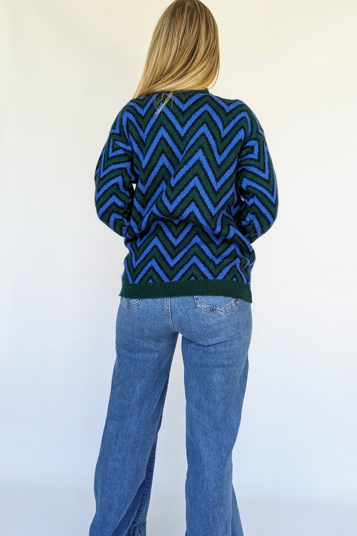back of 80s vintage zig zig jumper in green and blue