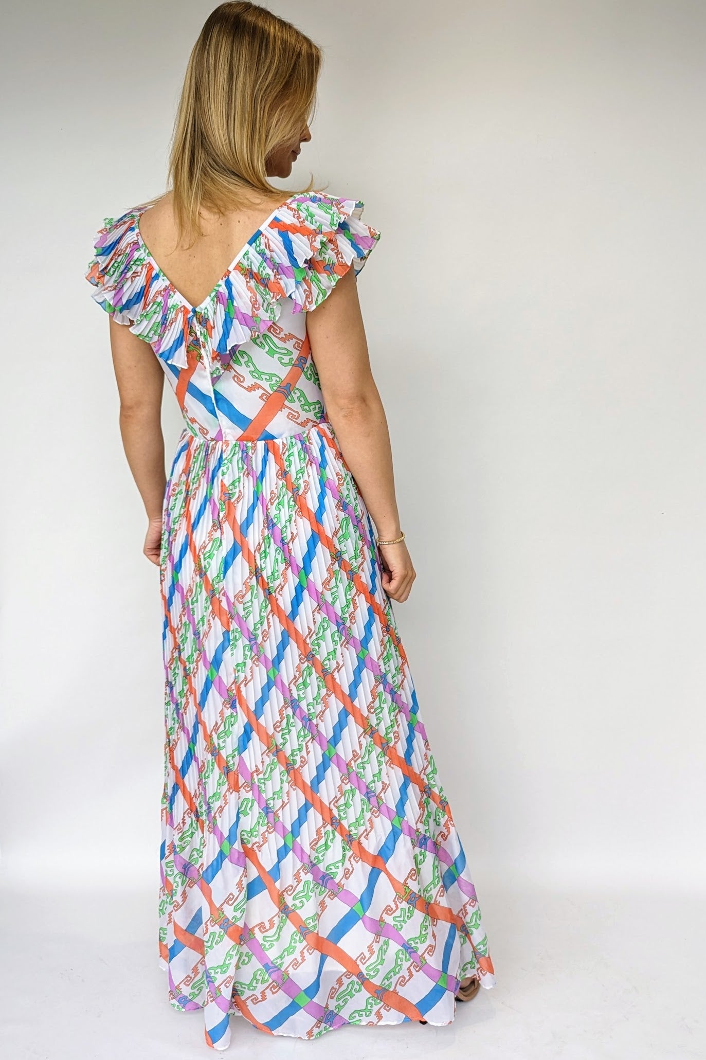 back v of vintage 1970s maxi dress with bold pattern of orange, green, blue and purple