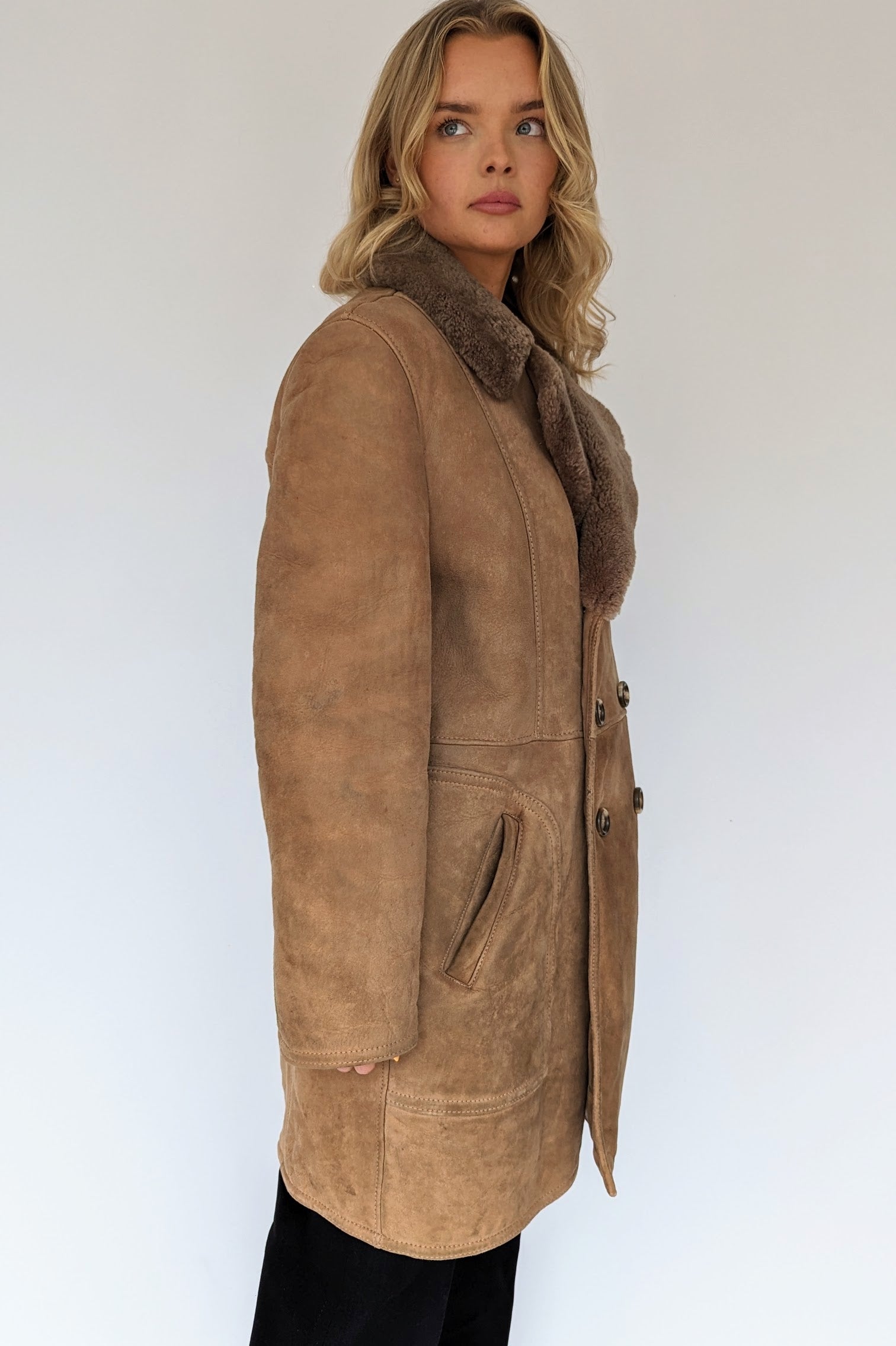 Side view of double breasted vintage sheepskin coat