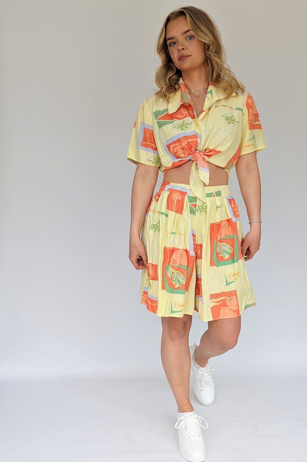 matching two piece shorts shirt set vintage from 1980s in pastel yellow and orange