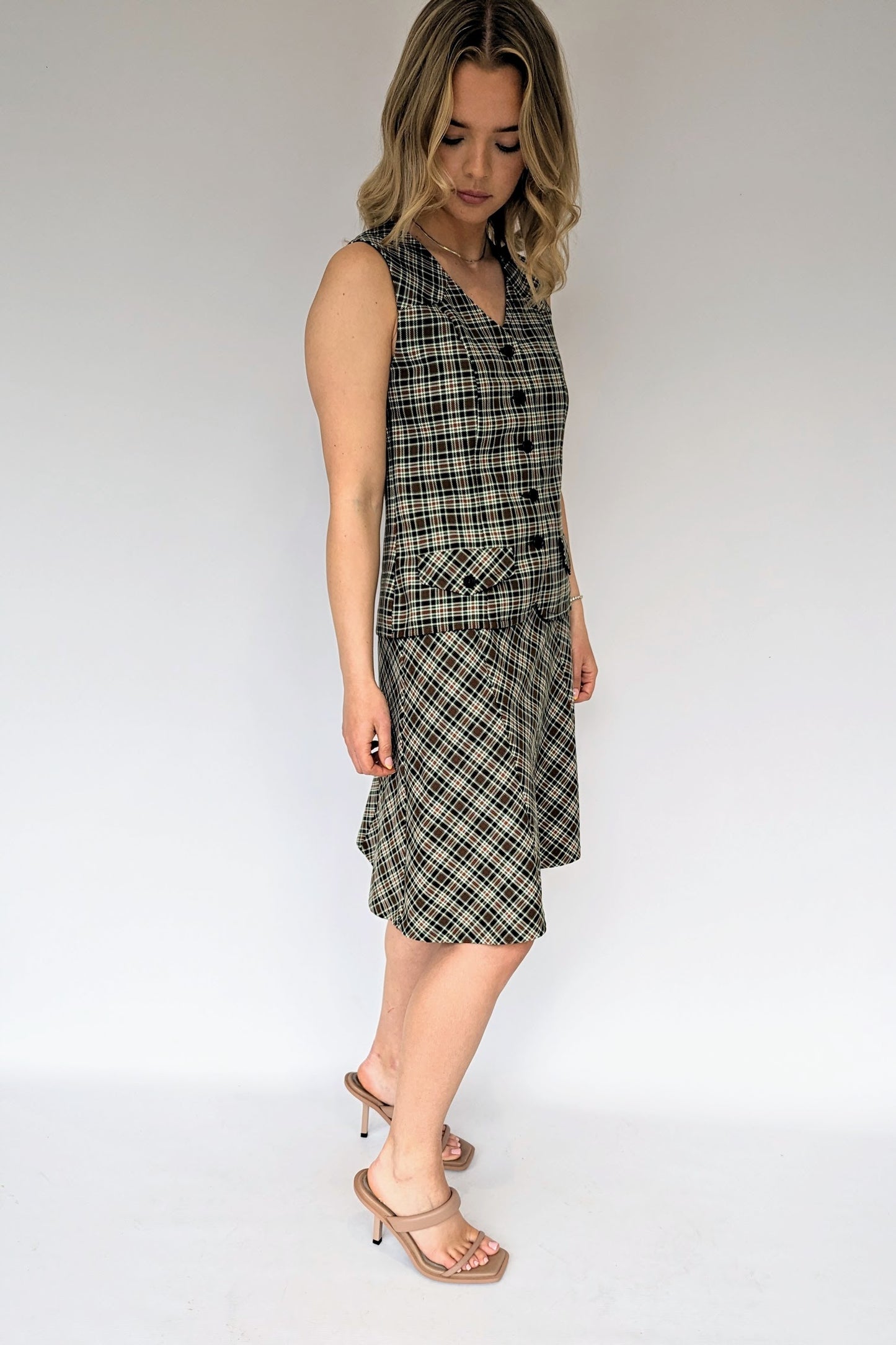 side view of Plaid check skirt suit from 1970s in khaki and brown with bare sleeves
